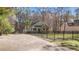 Charming home featuring a well-maintained lawn, privacy fence and mature landscaping at 113 Pony Dr, Louisburg, NC 27549