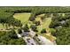 Aerial view of the golf course with well-maintained greens and surrounding landscape at 113 Pony Dr, Louisburg, NC 27549
