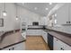 Well-lit kitchen with white cabinets, modern appliances, and a functional layout at 113 Pony Dr, Louisburg, NC 27549