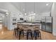 Spacious kitchen showcases a stone island, white cabinets, and stainless steel appliances at 113 Pony Dr, Louisburg, NC 27549