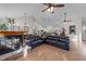 Open-concept living area featuring a fireplace, hardwood flooring, and vaulted ceilings at 113 Pony Dr, Louisburg, NC 27549