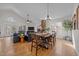 Open concept living room with a fireplace, hardwood floors and a vaulted ceiling at 113 Pony Dr, Louisburg, NC 27549