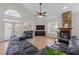 Spacious living room featuring hardwood floors, fireplace and vaulted ceiling at 113 Pony Dr, Louisburg, NC 27549