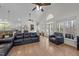 Bright living room features vaulted ceiling, hardwood floors, and natural light from large windows at 113 Pony Dr, Louisburg, NC 27549