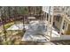 View of back patio with propane tank, basketball hoop and wooded area at 113 Pony Dr, Louisburg, NC 27549