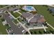 Beautiful aerial view of the neighborhood pool, clubhouse, putting green, and parking area at 1152 Solace Way, Rolesville, NC 27571