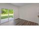 Bright interior with sliding glass doors leading to a patio and hardwood flooring at 1152 Solace Way, Rolesville, NC 27571