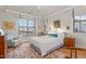 Bright bedroom featuring a large window, area rug, and elegant decor at 117 S Bloodworth St, Raleigh, NC 27601