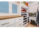 Walk-in closet with custom shelving, drawers, and wood countertop at 117 S Bloodworth St, Raleigh, NC 27601