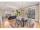 Bright dining room featuring hardwood floors, large windows, and an elegant chandelier at 117 S Bloodworth St, Raleigh, NC 27601
