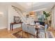 Dining area featuring wood floors, pendant lighting, and staircase at 117 S Bloodworth St, Raleigh, NC 27601