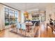 Open-concept dining area with modern lighting and hardwood floors and a view to the kitchen at 117 S Bloodworth St, Raleigh, NC 27601