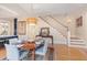 Elegant dining area with hardwood floors, a staircase, and stylish lighting at 117 S Bloodworth St, Raleigh, NC 27601