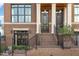 Close up of the home's dual front door entrance framed by white pillars at 117 S Bloodworth St, Raleigh, NC 27601