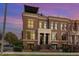 Beautiful brick townhome featuring a rooftop deck and professionally manicured landscaping at 117 S Bloodworth St, Raleigh, NC 27601