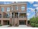 Charming brick townhome featuring a private balcony and convenient garage access in a desirable location at 117 S Bloodworth St, Raleigh, NC 27601