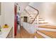 Welcoming foyer with a staircase featuring wood steps and white railings at 117 S Bloodworth St, Raleigh, NC 27601