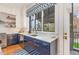 Gourmet kitchen boasting navy blue cabinets, quartz countertops, and stainless steel appliances at 117 S Bloodworth St, Raleigh, NC 27601