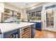 Well-equipped kitchen featuring a wine cooler, island, and stainless steel appliances at 117 S Bloodworth St, Raleigh, NC 27601