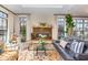 Bright living area with a tiled fireplace, hardwood floors and plenty of natural light at 117 S Bloodworth St, Raleigh, NC 27601