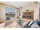 Elegant living room with hardwood floors, large windows, and a cozy fireplace at 117 S Bloodworth St, Raleigh, NC 27601