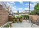 Patio with black metal chairs and potted plants at 117 S Bloodworth St, Raleigh, NC 27601