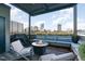 Inviting rooftop deck with a fire pit and comfortable seating, offering breathtaking skyline views at 117 S Bloodworth St, Raleigh, NC 27601