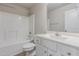 Bathroom shows shower over tub, modern toilet and sink vanity at 11771 Raleigh Rd, Four Oaks, NC 27524