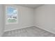 Cozy bedroom with window offering natural light and a serene view at 11771 Raleigh Rd, Four Oaks, NC 27524