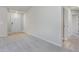 Bright foyer featuring neutral carpet, clean white walls, and a glimpse into adjacent rooms at 11771 Raleigh Rd, Four Oaks, NC 27524