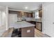 Well-appointed kitchen island with stainless steel appliances, granite countertops, and a breakfast bar at 11771 Raleigh Rd, Four Oaks, NC 27524