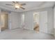 Large main bedroom boasts tray ceilings, carpet and multiple access points to the bath at 11771 Raleigh Rd, Four Oaks, NC 27524
