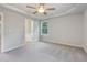 Spacious main bedroom with tray ceiling, neutral colors, and ensuite bath at 11771 Raleigh Rd, Four Oaks, NC 27524