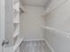 Walk-in closet boasts multiple shelving options for maximum storage at 11771 Raleigh Rd, Four Oaks, NC 27524