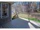 Well-maintained deck offering scenic views, perfect for enjoying nature in a tranquil setting at 1305 Bascomb Dr, Raleigh, NC 27614