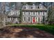 Traditional two-story home with dormer windows and a red door at 1305 Bascomb Dr, Raleigh, NC 27614