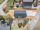 Bird's-eye view of the house showcasing its roof, driveway, and fully fenced backyard at 1335 Elrado St, Burlington, NC 27217