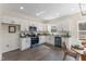 Modern kitchen featuring white cabinets, granite counters, and stainless steel appliances at 1335 Elrado St, Burlington, NC 27217