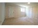 Spacious bedroom with carpet, closet, window, and access door at 134 Castlewood Dr, Cary, NC 27511