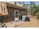 Screened in porch with patio area, outdoor furniture, grill and fan for summer gatherings at 138 Tramway Cir, Angier, NC 27501