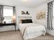 Well-lit bedroom featuring carpet floors, lamp, two windows with curtains and neutral decor at 141 N District Ave # 295, Clayton, NC 27527