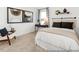 Charming bedroom featuring carpet floors, window with curtains, artwork and a chair at 141 N District Ave # 295, Clayton, NC 27527