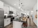 Modern kitchen features white cabinets, black granite countertops, and stainless steel appliances at 141 N District Ave # 295, Clayton, NC 27527
