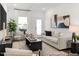 Comfortable living room with a neutral color palette, modern decor, and natural light at 141 N District Ave # 295, Clayton, NC 27527