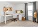 Modern office with sleek white desk, natural light, and stylish decor, perfect for productivity at 141 N District Ave # 295, Clayton, NC 27527