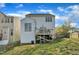 View of the home's backyard, featuring a raised wooden deck and partially fenced-in yard at 1968 Shadow Glen Dr, Raleigh, NC 27604