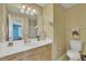 Well-lit bathroom with vanity, mirror, and toilet at 1968 Shadow Glen Dr, Raleigh, NC 27604