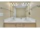 Bathroom featuring a large mirror, double sinks, and a closet at 1968 Shadow Glen Dr, Raleigh, NC 27604