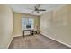 Bedroom showcasing neutral paint, a window, ceiling fan, and ample space for work or relaxation at 1968 Shadow Glen Dr, Raleigh, NC 27604