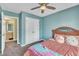 Comfortable bedroom with a ceiling fan, a window with blinds, and ample closet space at 1968 Shadow Glen Dr, Raleigh, NC 27604